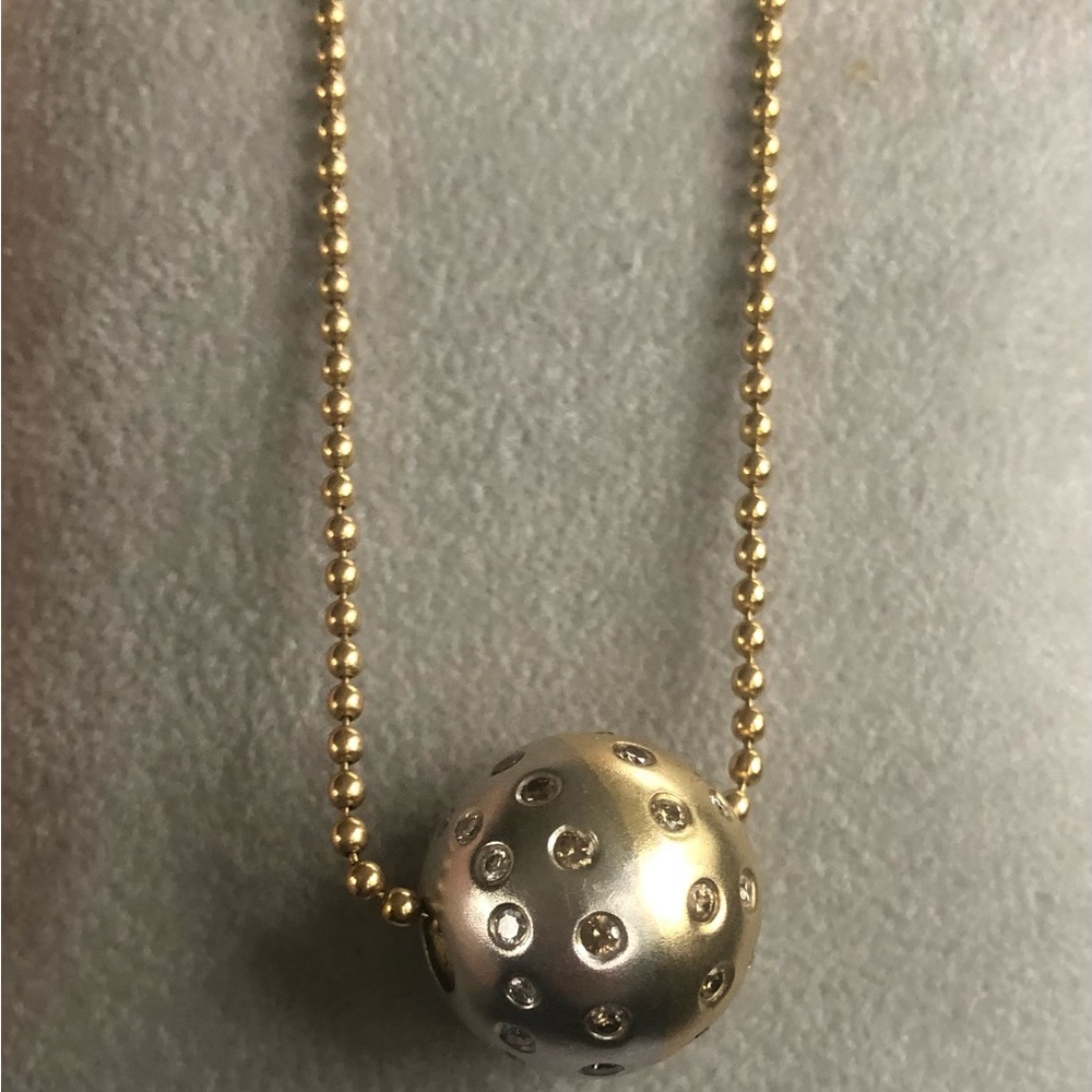 14Kt Unique 2 tone gold ball pendant with diamonds on bead chain.